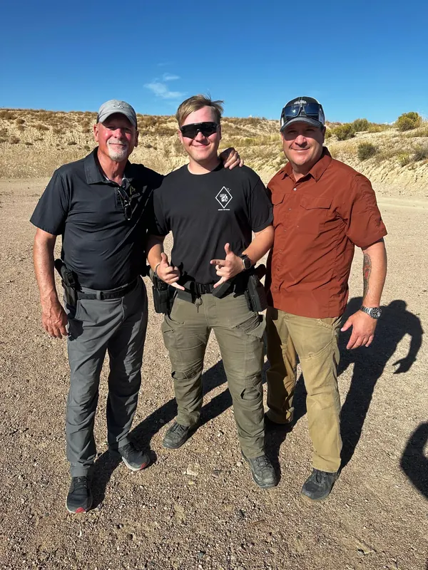 Instructor and students at the range